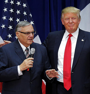 U.S. Republican presidential candidate Donald Trump is joined onstage by Maricopa County Sheriff Joe Arpaio (L) at a campaign rally in Marshalltown, Iowa January 26, 2016, after Arpaio endorsed Trump's. REUTERS/Brian Snyder - RTX245CC