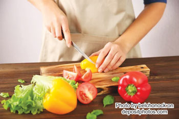person chopping vegetables